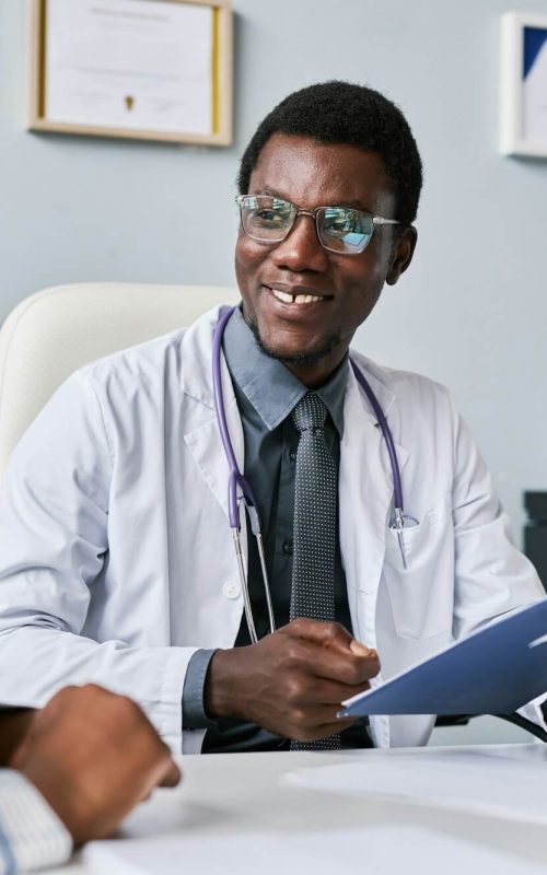 smiling-black-doctor-consulting-female-doctor-in-clinic.jpg smiling-black-doctor-consulting-female-doctor-in-clinic.jpg